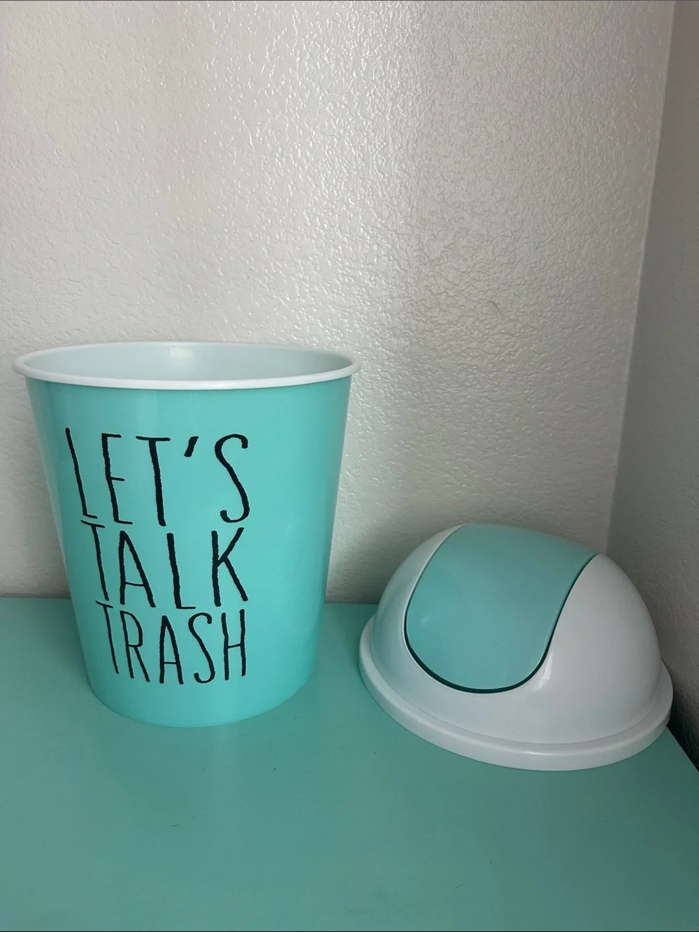 Essential Home Designs-basic plastic trash can with swinging top-new